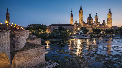 Illuminated buildings in water