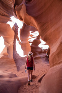 Full length of a woman walking on rock