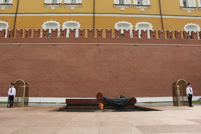 People sitting outside building
