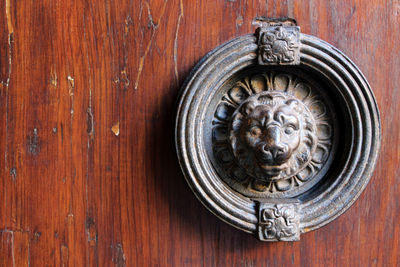 Close-up of sculpture on wooden door