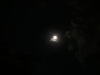 Low angle view of moon in sky at night