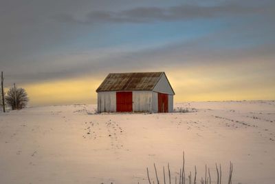 View of hut at sunset