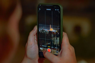 Close-up of hand holding smart phone