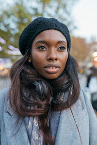 Portrait of smiling young woman in winter