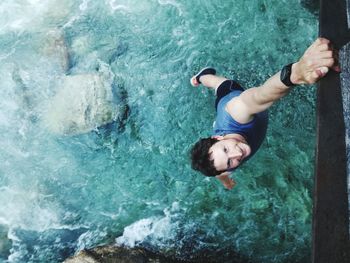 High angle view of man hanging