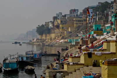 High angle view of harbor by buildings in city