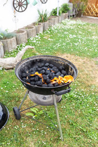 High angle view of meat on barbecue grill in yard