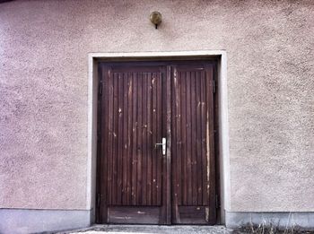 Closed wooden door of house