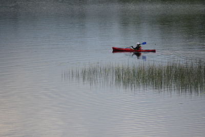 Man on boat in lake