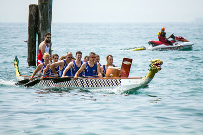 People in boat at sea