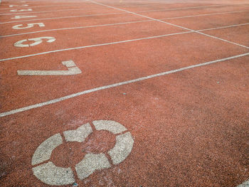 High angle view of numbers on running track in stadium