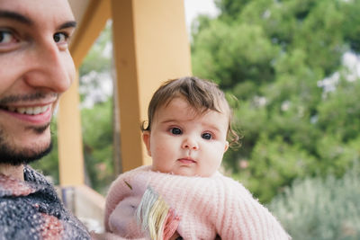 Portrait of cute mother and daughter outdoors