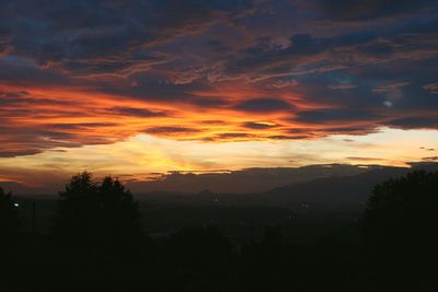 Scenic view of dramatic sky during sunset