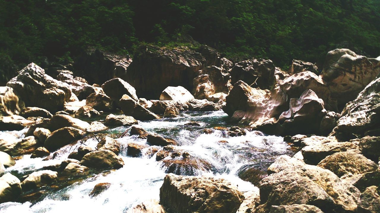 water, rock - object, nature, beauty in nature, rock formation, tranquility, scenics, tranquil scene, rock, tree, forest, river, idyllic, no people, non-urban scene, day, outdoors, sunlight, stream, non urban scene