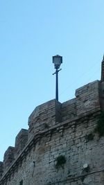 Low angle view of built structure against blue sky