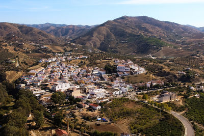 High angle view of trees and mountains against sky