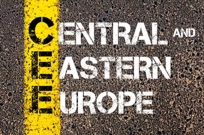 Close-up of arrow sign on road