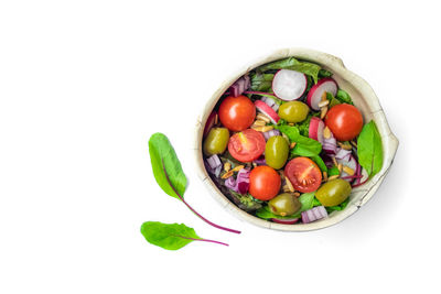 Close-up of tomatoes against white background