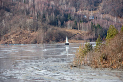 Church submerged by toxic waste waters from  gold mine. decantation lake, geamana, romania