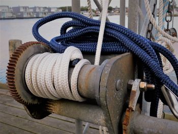 Close-up of rope tied to metal pipe