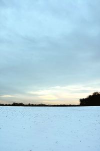 Scenic view of lake against sky during winter