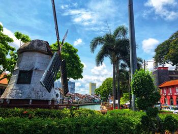 Trees and buildings against sky