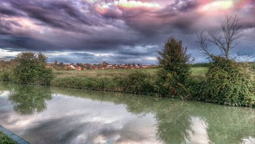 Scenic view of landscape against cloudy sky