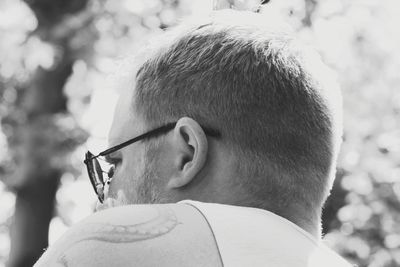 Close-up portrait of boy wearing sunglasses outdoors