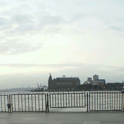 View of buildings against cloudy sky