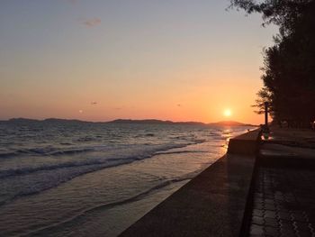 Scenic view of beach against sky during sunset