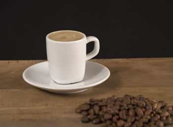 Close-up of coffee cup on table