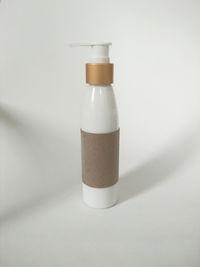 Close-up of empty glass bottle on table