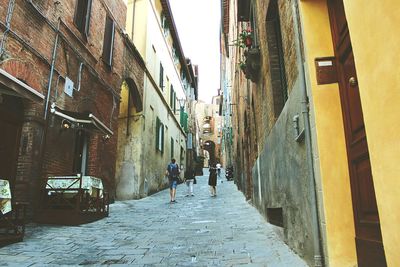 Narrow alley with buildings in background