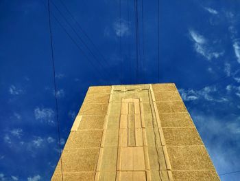 Low angle view of building against blue sky