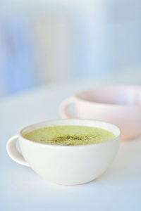 Close-up of coffee cup on table