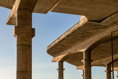 Low angle view of old bridge against sky