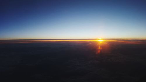 Scenic view of sea against clear sky during sunset