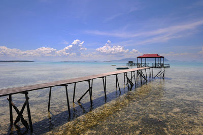 Scenic view of sea against blue sky