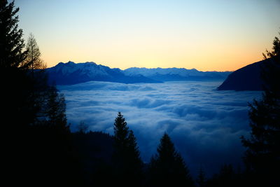 Scenic view of silhouette mountains against sky during sunset
