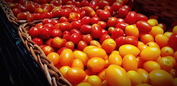 High angle view of tomatoes in basket for sale