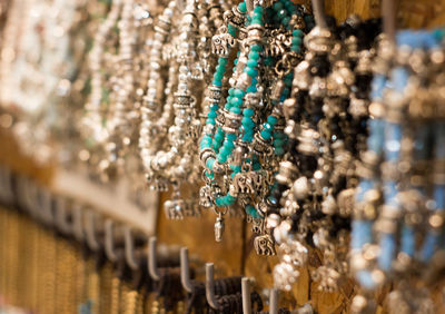 Close-up of necklaces at store