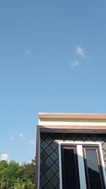 Low angle view of building against blue sky