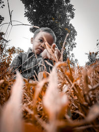 Portrait of man on field against sky