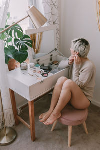 Woman sitting on chair at table