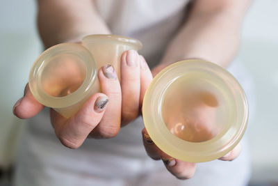 Close-up of hand holding tea cup