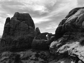 Low angle view of rock formation against sky