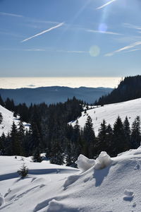 Scenic view of snowcapped mountains against sky