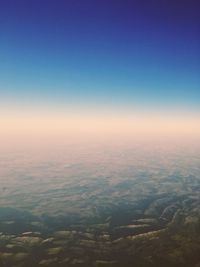 Aerial view of landscape against clear sky at night