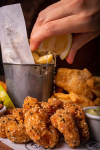 Cropped hand of person preparing food
