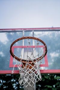 Low angle view of basketball hoop against sky